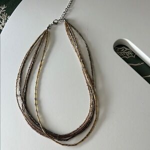 Elegant Multi-Strand Necklace in Gold and Silver